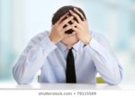 businessman-depression-hand-on-forehead-260nw-79115569.jpg